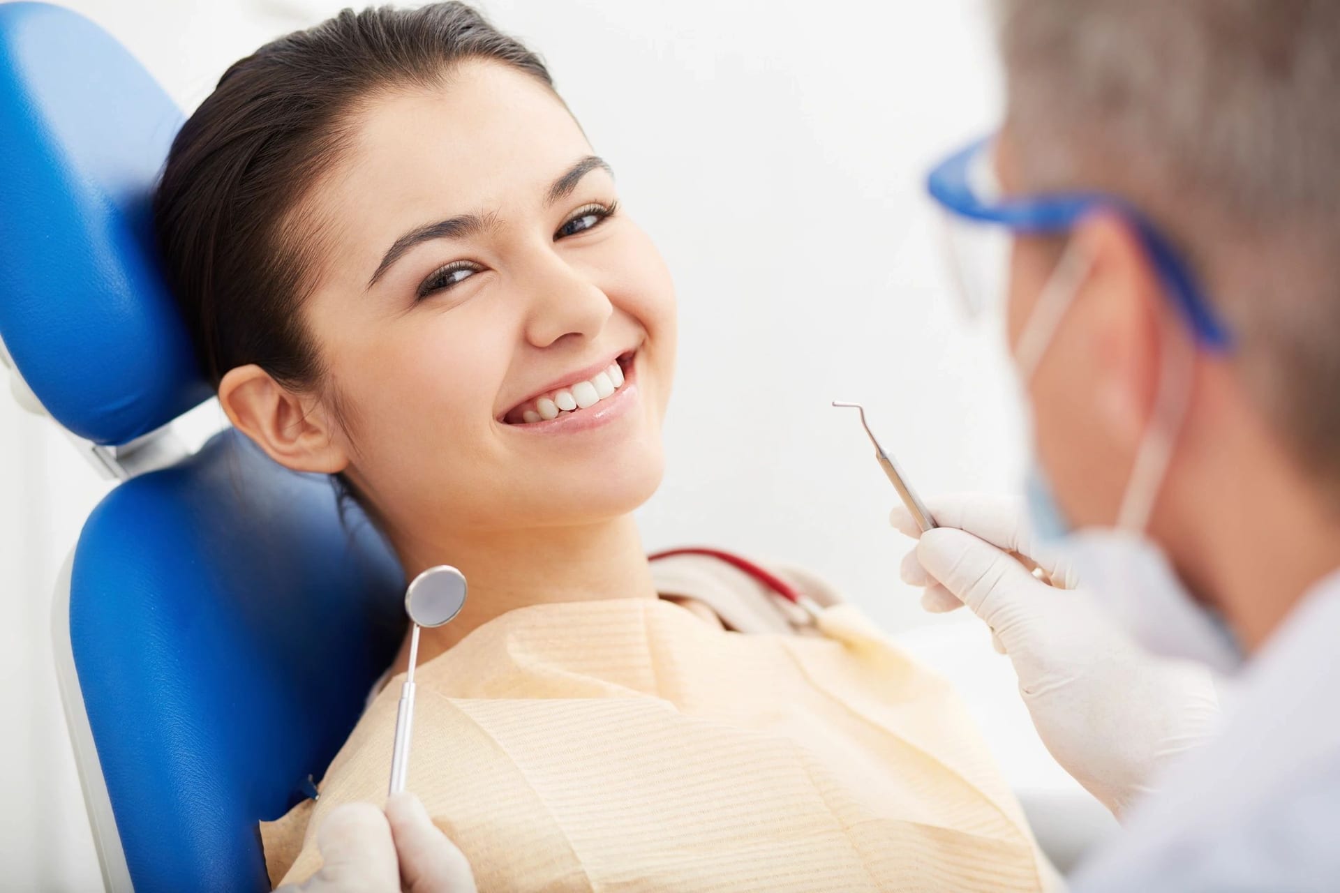 A smiling patient in the dental chair at Waterford Dental Associates during a routine checkup